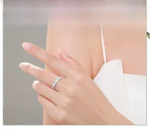 Macro detail of a 925 silver ring featuring baguette-cut zircon stones on a model's finger
