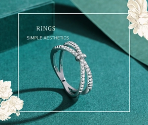 Macro detail of S925 sterling silver criss-cross ring with sparkling zircon pavé