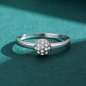 Elegant S925 sterling silver ring with micro-pave zircon sphere on dark green background