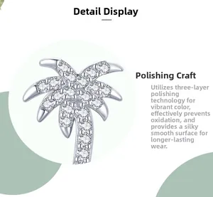 Macro view of S925 silver palm tree stud earrings with micropave cubic zirconia crystals