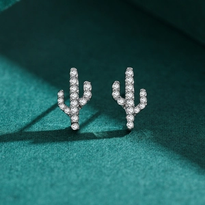Sparkling S925 silver cactus stud earrings with micro-pave crystals on a dark green base