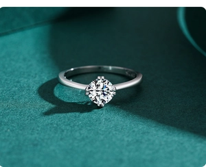 Macro view of S925 sterling silver ring featuring a four-prong set sparkling round diamond
