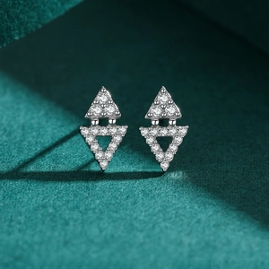 S925 sterling silver geometric triangle stud earrings with cubic zirconia on green velvet