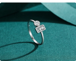 Macro detail of S925 silver open ring featuring round and rectangular zircon stones