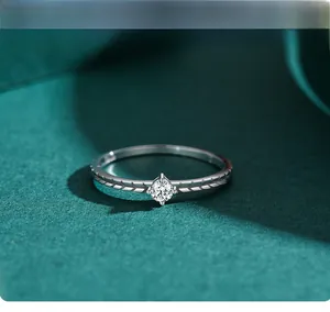 Close-up of S925 silver ring with engraved wheat patterns and round zircon center stone