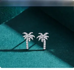 Macro detail of S925 sterling silver coconut tree stud earrings with micro zircon inlays