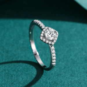S925 sterling silver square halo ring with round zircon on a green velvet background
