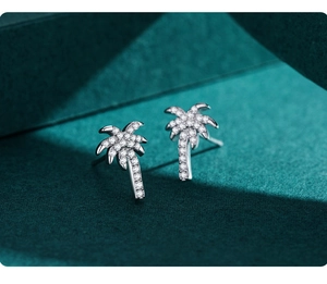 Macro shot of S925 sterling silver palm tree stud earrings with zircon micro-paving