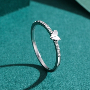 S925 sterling silver heart ring with sparkling cubic zirconia on a green display stand