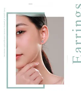 Close-up of hexagonal s925 silver stud earrings with six-prong set cubic zirconia on ear