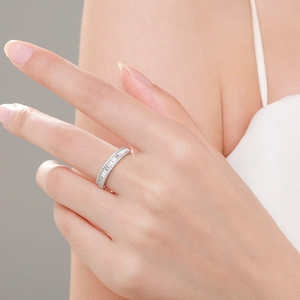Elegant s925 silver eternity band ring featuring baguette-cut cubic zirconia on finger