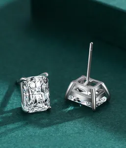 Macro view of rectangular radiant cut silver studs with classic four-prong setting details