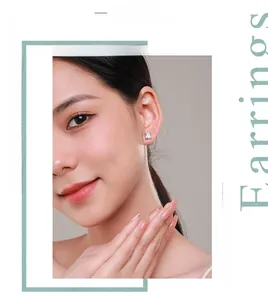 Detail view of square-cut zircon stud earring on ear with minimalist silver claw setting