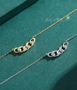 Macro detail of S925 silver necklaces with interlocking circles and sparkling zircons