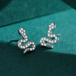 Elegant S925 sterling silver snake stud earrings with pavé white zircons on velvet