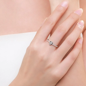 S925 sterling silver pear cut teardrop ring with pavé diamonds on model hand