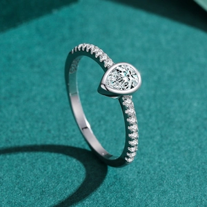 S925 sterling silver ring featuring a pear-cut teardrop diamond on dark green stand