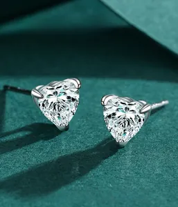 Close-up of heart-cut cubic zirconia stud earrings in S925 sterling silver prong setting