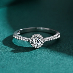 Classic round brilliant cut halo silver ring with shimmering pavé band setting