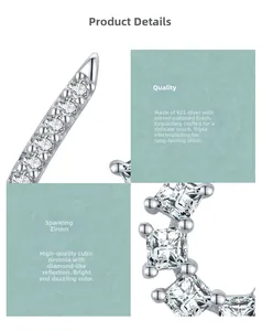 Macro detail of 925 sterling silver earring with polished finish and cubic zirconia inlay