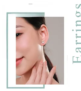 Close-up of heart-shaped s925 silver stud earring with zircon on model's ear