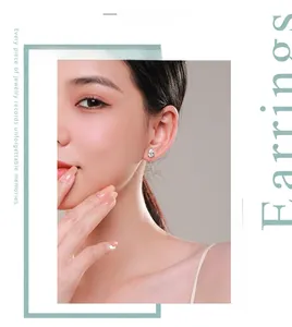 On-ear model shot of elegant silver teardrop stud earrings with sparkling cubic zirconia
