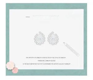 Artistic design sketch of luxury pear-cut silver earrings with detailed halo pavé settings