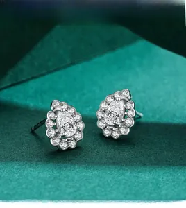Close-up of S925 silver pear-cut halo stud earrings with micro-pave cubic zirconia settings