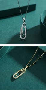 Close-up of interlocking oval pendant necklace with silver and gold finishes and zircons