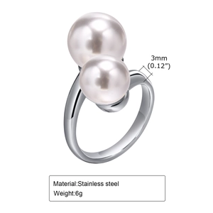 Detail view of a 3mm golden stainless steel ring showing 6g weight and double pearl feature