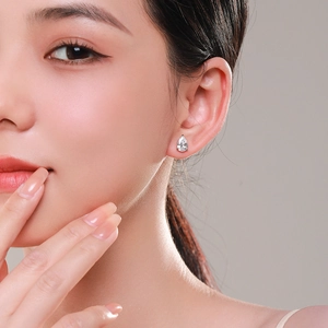 Elegant S925 sterling silver pear cut teardrop zircon stud earrings worn by model