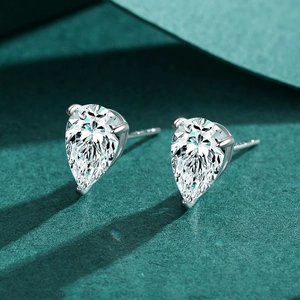 Elegant s925 silver pear-cut teardrop stud earrings with cubic zirconia on green surface