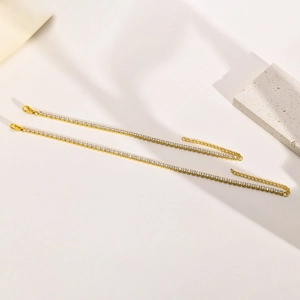 Two 18K gold plated tennis bracelets with sparkling cubic zirconia and extender chains