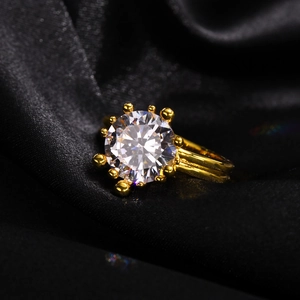 Luxurious gold ring featuring a large round zircon stone with ten-claw beaded setting