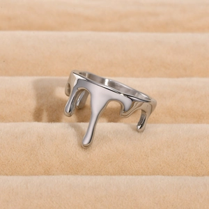 Macro shot of silver liquid lava ring featuring high polish finish in jewelry display box