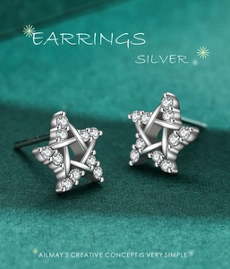 Macro shot of S925 sterling silver star stud earrings featuring micro-pave cubic zirconia