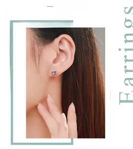 Close-up of S925 sterling silver hollow heart earrings with sparkling zircon stones