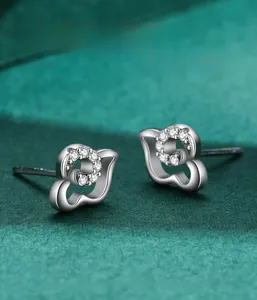 Macro shot of s925 silver cloud stud earrings with sparkling micro-set zircon crystals