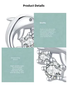 Macro des boucles d'oreilles dauphin en argent s925 avec zircons cubiques scintillants