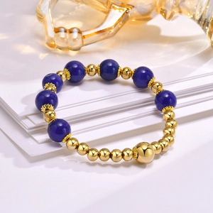 Detailed shot of lapis lazuli beads with gold stainless steel accents on a stylish bracelet