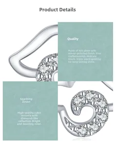 Detailed macro view of S925 sterling silver cloud stud earrings with cubic zirconia inlay