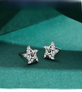Macro shot of S925 sterling silver star stud earrings with pave-set cubic zirconia stones