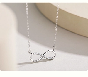 Close-up of S925 sterling silver infinity pendant necklace with sparkling pavé cubic zirconia