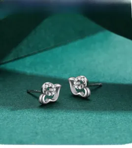 Macro view of sterling silver butterfly stud earrings with micro-set zircon details