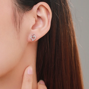 Elegant S925 silver double heart stud earrings with white zircon pavé on model