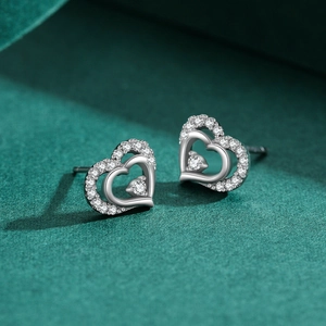 Elegant S925 sterling silver hollow heart earrings with sparkling zircon stones