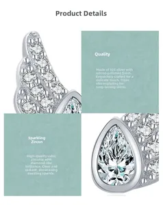 Macro view of S925 sterling silver angel wing earring with cubic zirconia inlay
