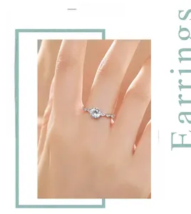 Detail of 925 sterling silver ring with 1 carat round diamond worn on a woman's finger