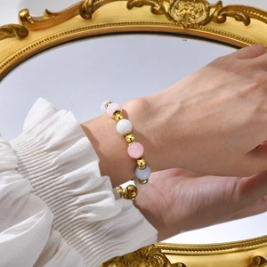 Golden stainless steel beaded bracelet with pink and blue natural stones and pearls