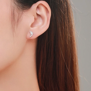 Sparkling S925 sterling silver dolphin stud earrings with cubic zirconia on model